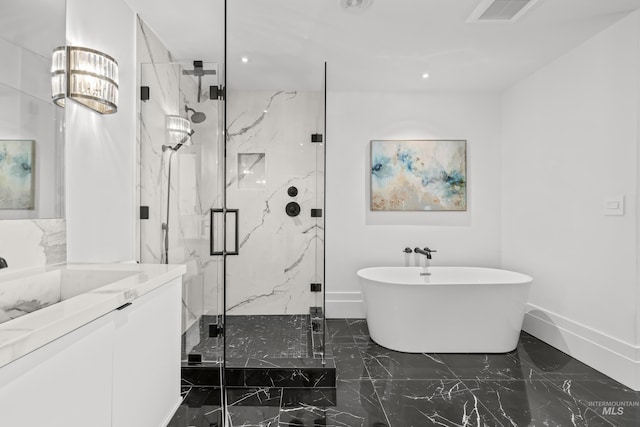 255 S Capitol Blvd Unit 1403, Boise, ID 83702 - bathroom featuring marble tiled flooring, a freestanding bath, a marble finish shower, vanity, and recessed lighting