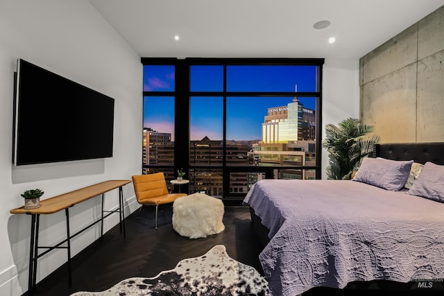 255 S Capitol Blvd Unit 1403, Boise, ID 83702 - bedroom featuring floor to ceiling windows, a city view, wood finished floors, and recessed lighting