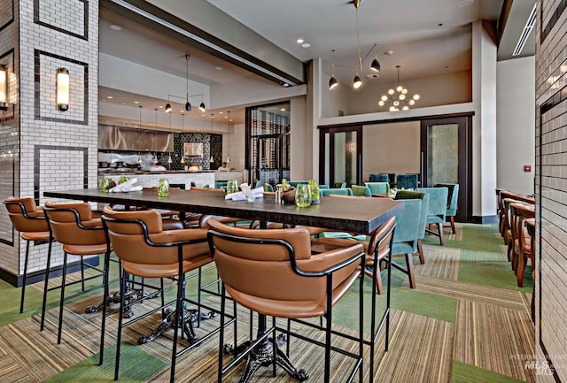255 S Capitol Blvd Unit 1403, Boise, ID 83702 - carpeted dining area with a towering ceiling and a chandelier