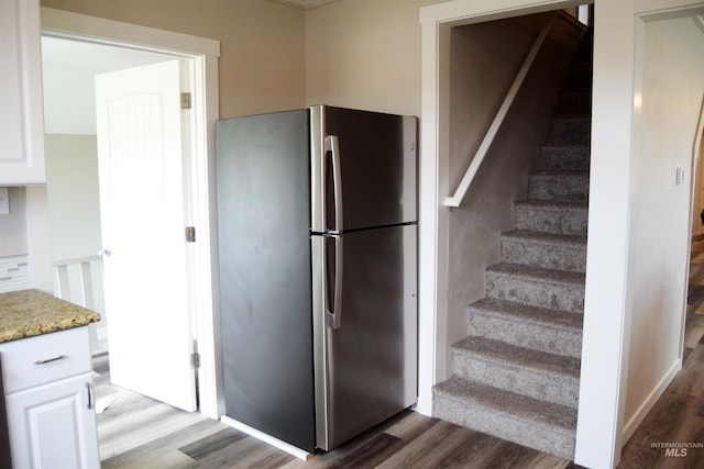 stairs with wood finished floors