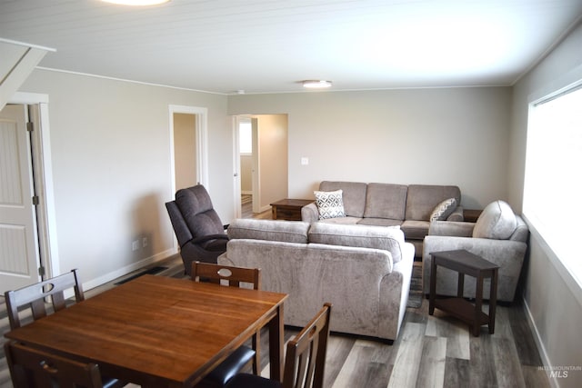 living room with baseboards and wood finished floors