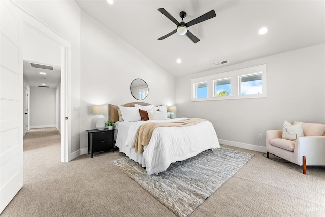 bedroom with vaulted ceiling, visible vents, light colored carpet, and baseboards