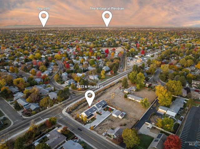 aerial view at dusk with a residential view