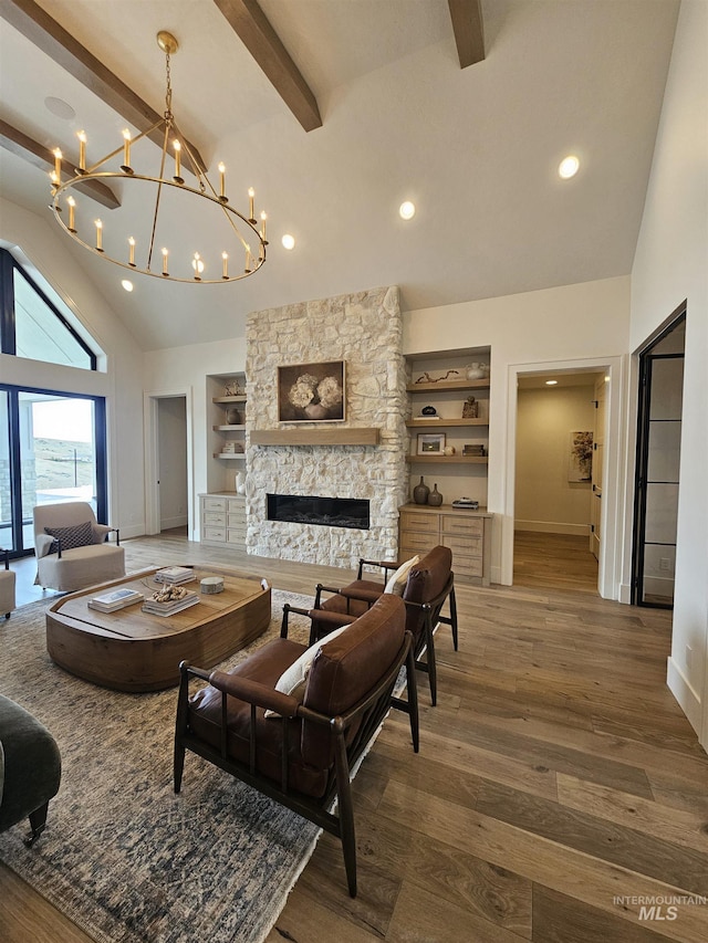 11444 N 17th Way, Boise, ID 83714 - living area with high vaulted ceiling, baseboards, a fireplace, beamed ceiling, and a chandelier