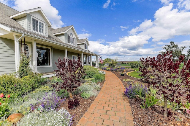 2350 Trail Rd, Moscow, ID 83843 - view of side of property featuring a porch and a shingled roof