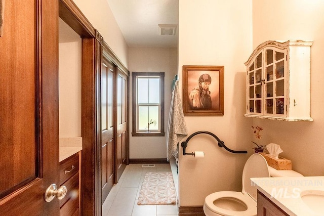 2350 Trail Rd, Moscow, ID 83843 - full bath featuring vanity, toilet, tile patterned flooring, and baseboards