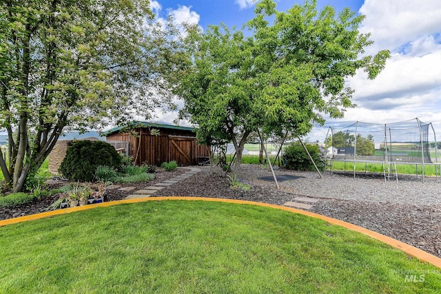 2350 Trail Rd, Moscow, ID 83843 - view of grassy yard featuring a trampoline