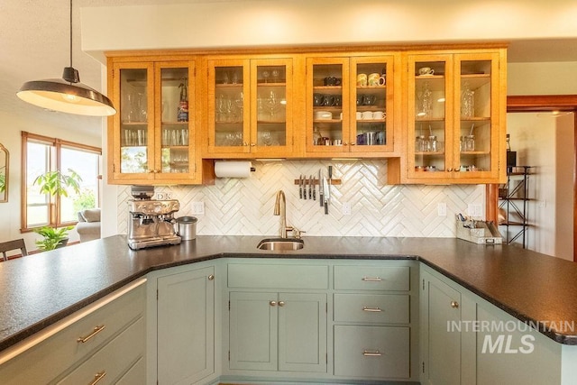2350 Trail Rd, Moscow, ID 83843 - kitchen featuring a sink, decorative backsplash, and dark countertops