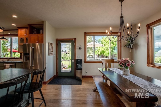 2350 Trail Rd, Moscow, ID 83843 - dining space featuring a chandelier, dark wood-style floors, baseboards, and recessed lighting