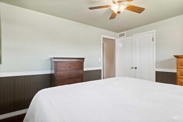 2074 11th Ave E, Twin Falls, ID 83301 - bedroom with a wainscoted wall and a ceiling fan