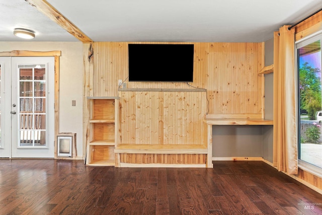 2074 11th Ave E, Twin Falls, ID 83301 - unfurnished living room with wood finished floors, wooden walls, and baseboards