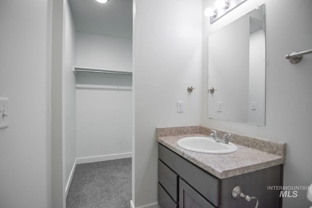 4044 W Ski Jump Ln, Meridian, ID 83642 - bathroom with baseboards and vanity
