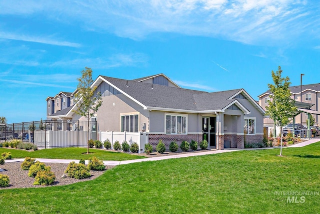 4044 W Ski Jump Ln, Meridian, ID 83642 - view of front of home featuring a front lawn, stucco siding, fence, and brick siding