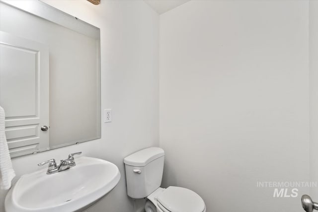 bathroom with sink and toilet