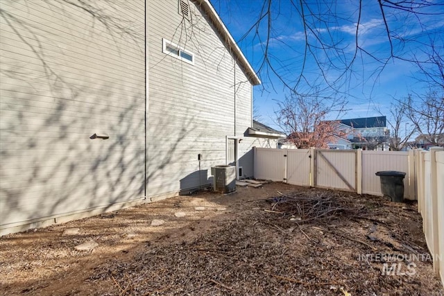 view of side of property with central AC unit