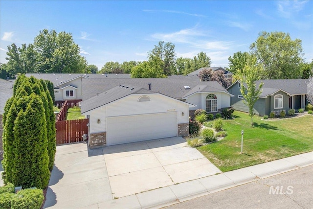 14325 W Comisky, Boise, ID 83713 - view of front of house with a garage, concrete driveway, and brick siding