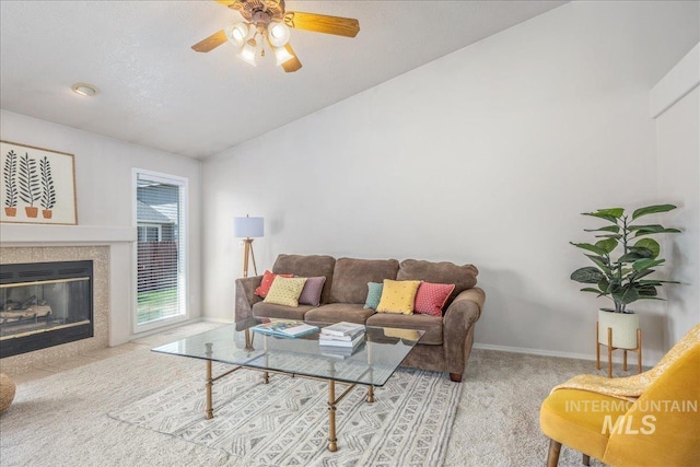 14325 W Comisky, Boise, ID 83713 - carpeted living area with ceiling fan, lofted ceiling, and a tile fireplace