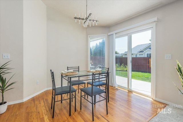 14325 W Comisky, Boise, ID 83713 - dining area with a chandelier and light wood-style floors