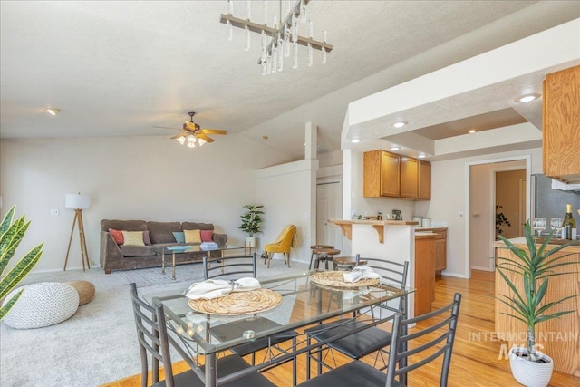 14325 W Comisky, Boise, ID 83713 - dining area featuring ceiling fan, a textured ceiling, light wood-style floors, recessed lighting, and lofted ceiling