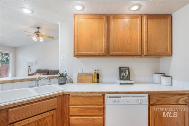 14325 W Comisky, Boise, ID 83713 - kitchen with dishwasher, a ceiling fan, light countertops, brown cabinets, and vaulted ceiling