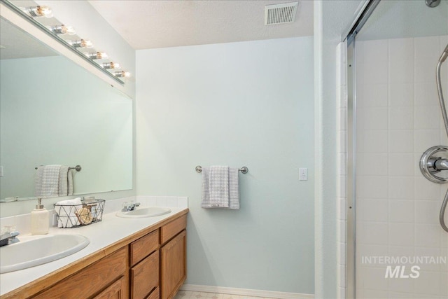 14325 W Comisky, Boise, ID 83713 - bathroom featuring tiled shower and double vanity