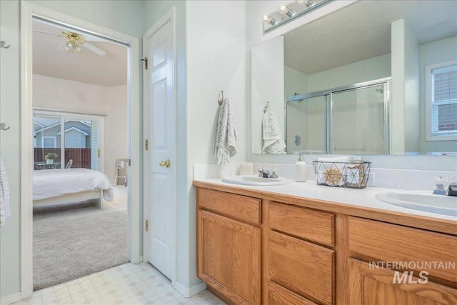 14325 W Comisky, Boise, ID 83713 - bathroom featuring ensuite bathroom, a shower stall, double vanity, and tile patterned floors