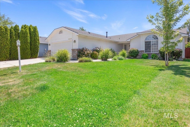 14325 W Comisky, Boise, ID 83713 - ranch-style house with concrete driveway, a garage, a front lawn, and brick siding