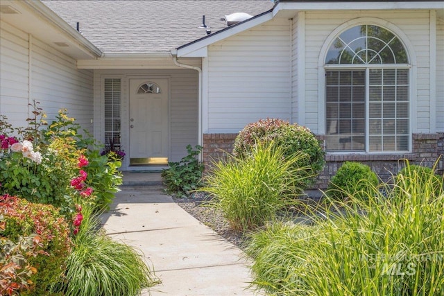 14325 W Comisky, Boise, ID 83713 - entrance to property featuring a shingled roof and brick siding
