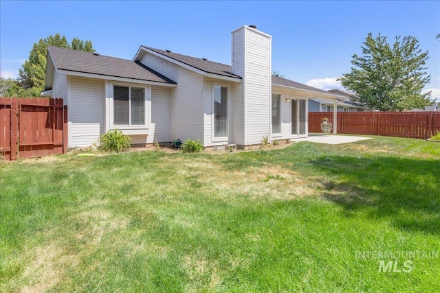 14325 W Comisky, Boise, ID 83713 - rear view of property with a patio area and a chimney