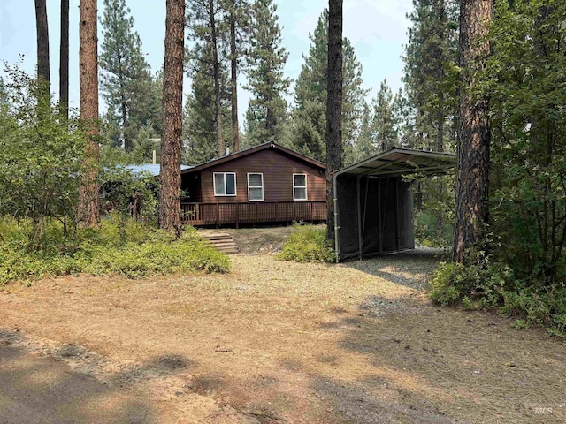 view of property exterior featuring a carport