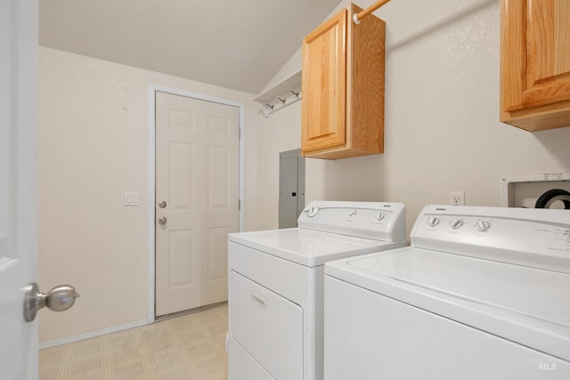 laundry room featuring cabinets and washer and clothes dryer