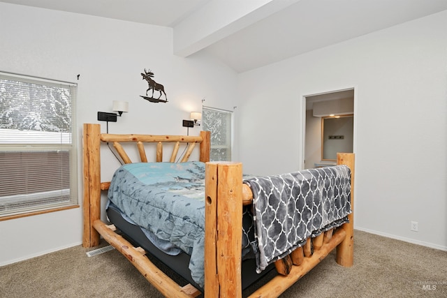 carpeted bedroom featuring beamed ceiling