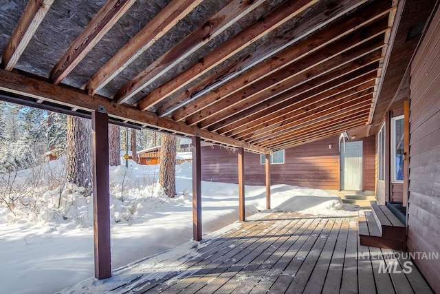 view of snow covered deck