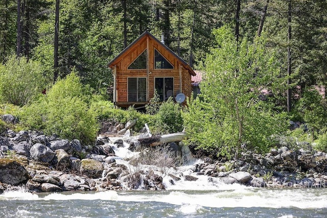 exterior space with a water view