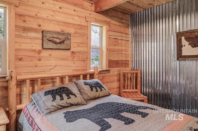 bedroom with beamed ceiling, wooden ceiling, and multiple windows