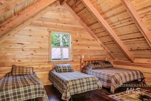 bedroom featuring wooden walls, lofted ceiling with beams, hardwood / wood-style floors, and wooden ceiling