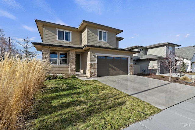 view of front of home featuring a garage and a front yard