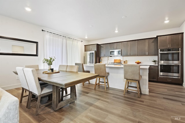 dining room with wood-type flooring