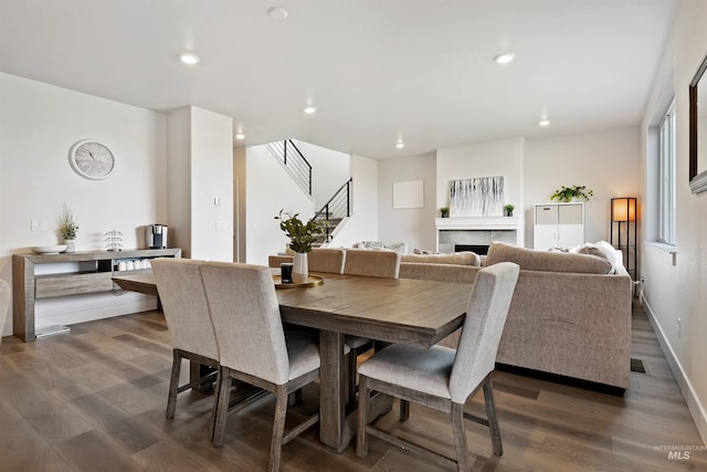 dining area with dark hardwood / wood-style floors