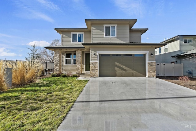 view of front of house featuring a front yard and a garage