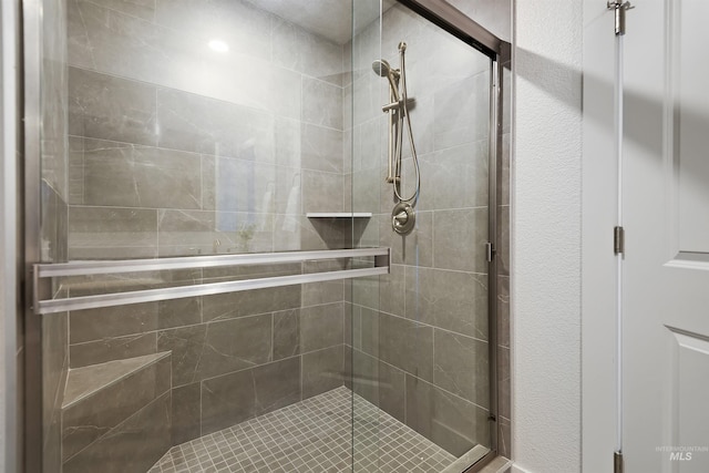 bathroom featuring an enclosed shower