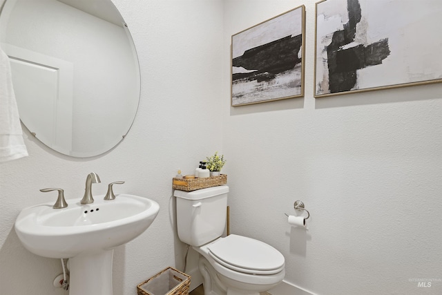 bathroom with sink and toilet