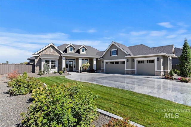 craftsman-style house with a garage and a front yard