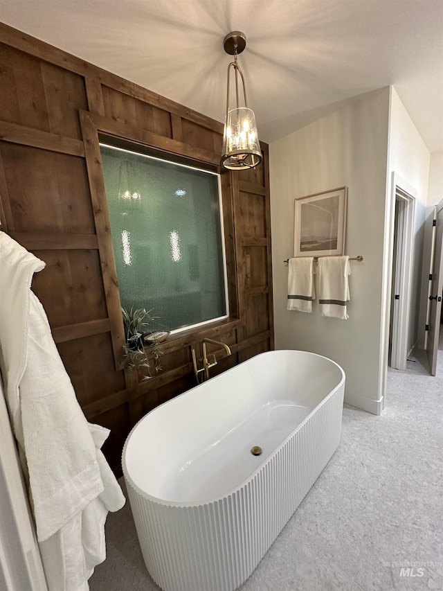 2253 Caribel St, Twin Falls, ID 83301 - full bathroom featuring a freestanding tub and a chandelier