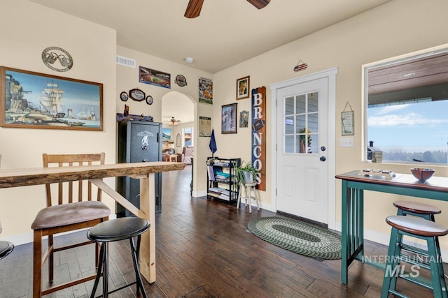 foyer entrance with dark hardwood / wood-style floors and ceiling fan