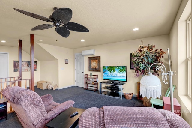 carpeted living room with ceiling fan, a wall mounted AC, and a textured ceiling