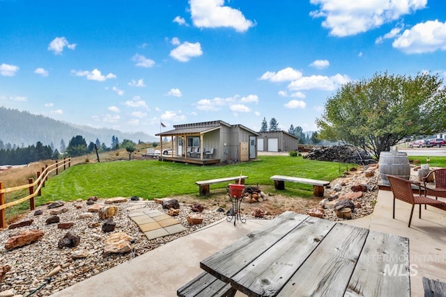 view of patio featuring a deck with mountain view