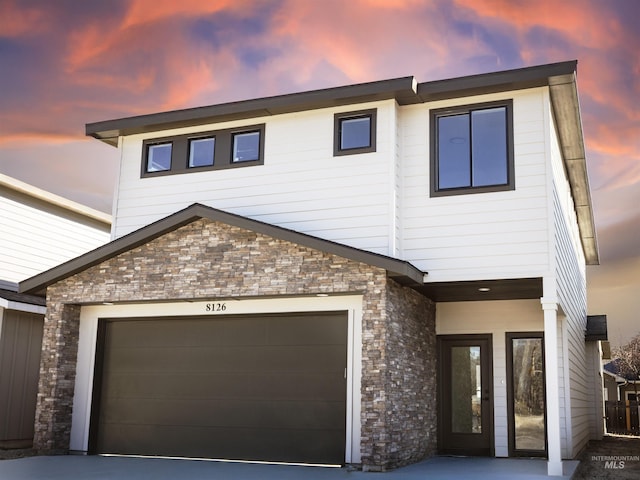 view of front of property with a garage