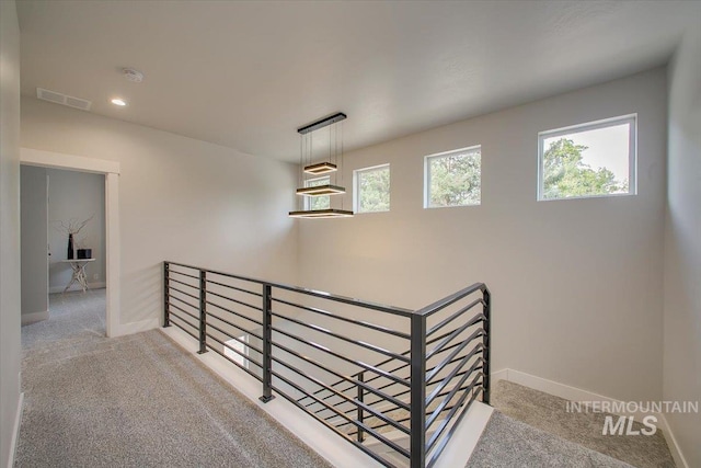 8126 N Breezy Ave, Boise, ID 83714 - hallway featuring light carpet