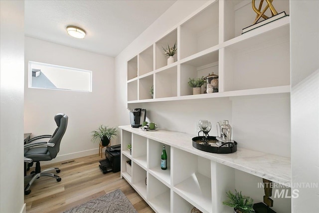 8126 N Breezy Ave, Boise, ID 83714 - office space featuring light hardwood / wood-style floors